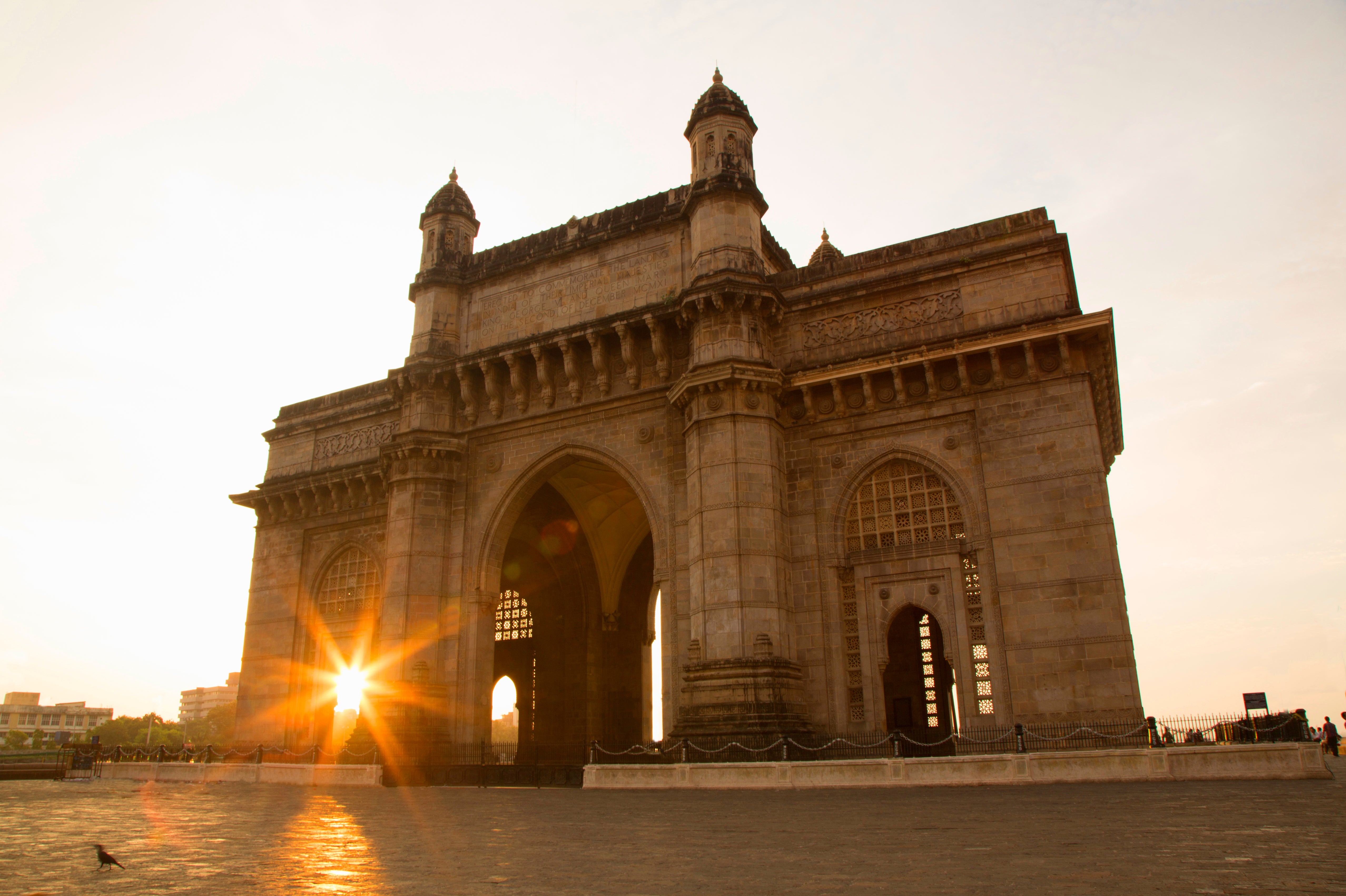 The Gateway of India in Mumbai, India, captured at sunset. Hybrica handbags designer handbags origin story of mumbai.