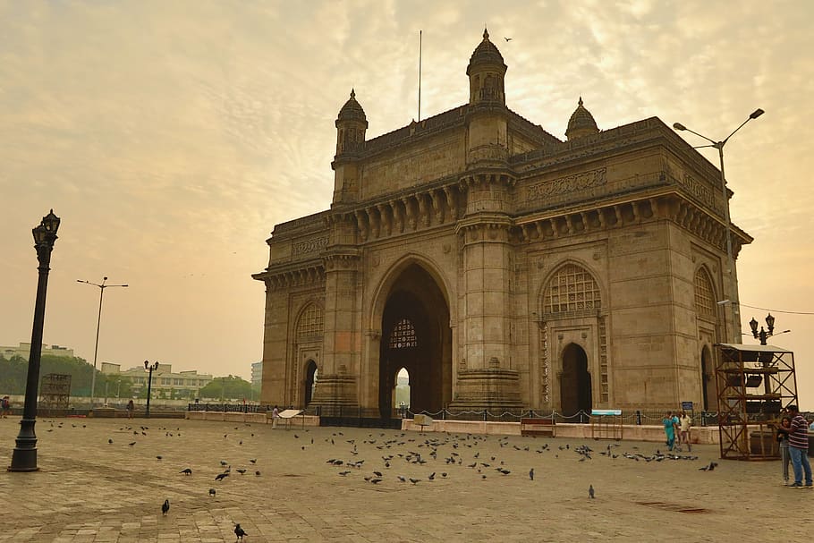 Gateway of India monument in Mumbai with a cloudy sky